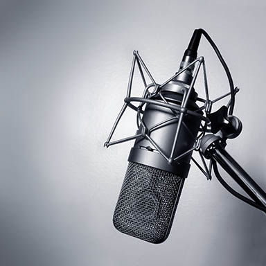 798982 – black and white image of a studio microphone.